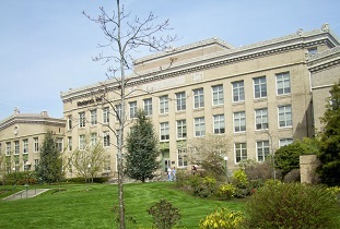 Mackenzie Hall with lawn and landscaping in the foreground