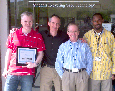 A photo of students recycling used technology and OHSU ITG staff