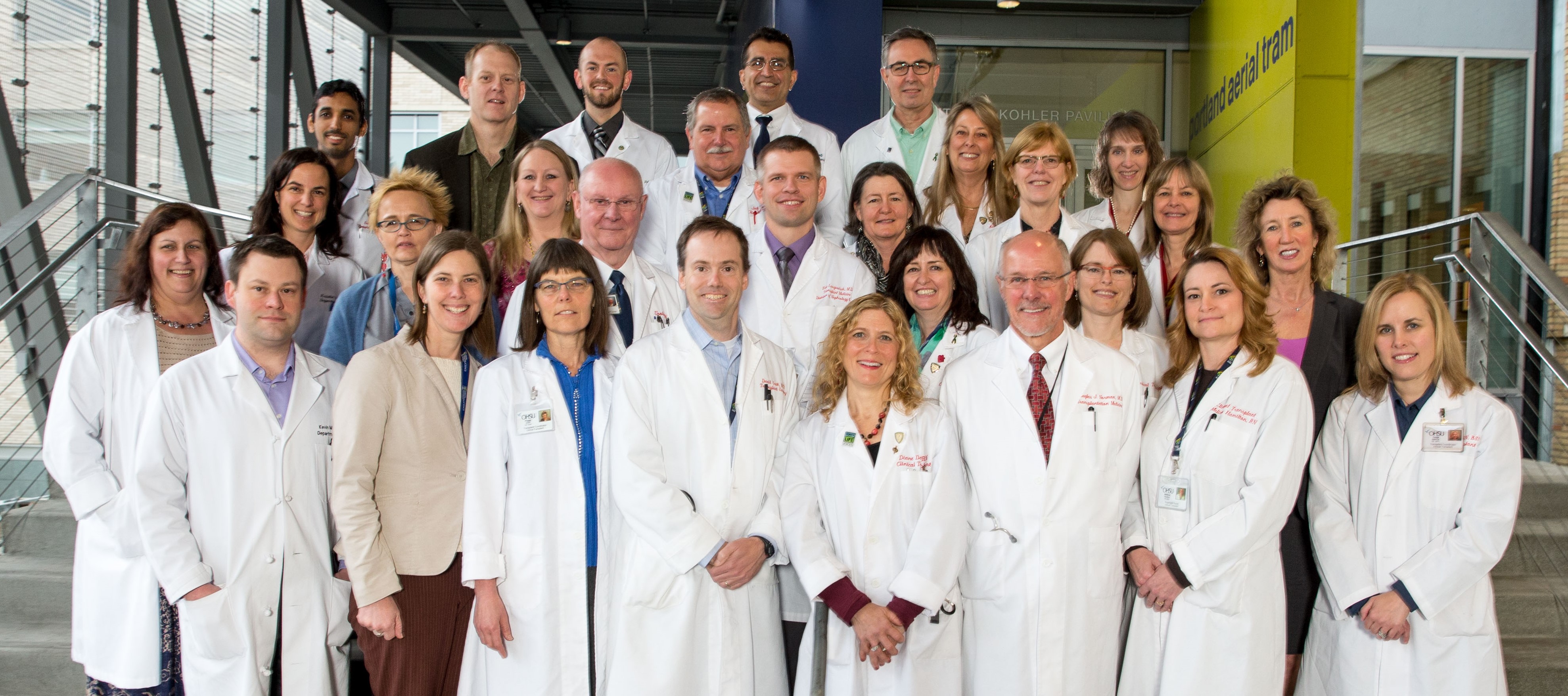 The Clinical Transplant Services Team standing together a the OHSU enterence