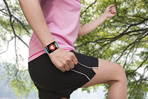 Runner with fitness tracker on wrist