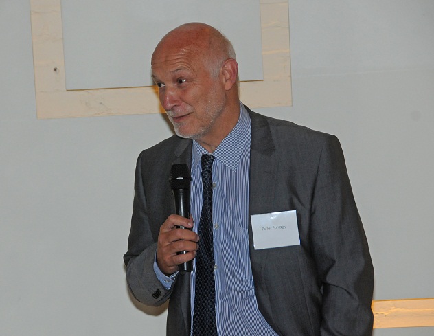Dr. Peter Fonagy speaking with microphone