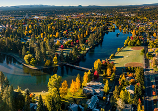 Aerial view of Bend and Deschutes river in the evening in Central Oregon