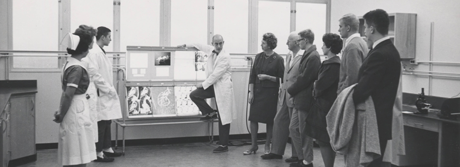 Charles Dotter with a group in the lab