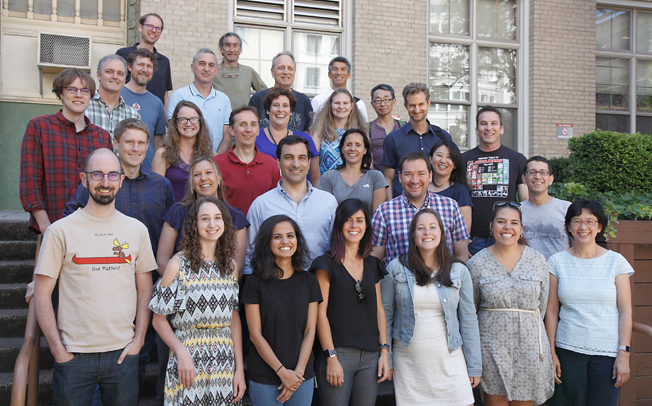 Attendees of the John T. Williams Neuroscience Retreat, July 2018, gather for a group photo in the Mac Hall courtyard