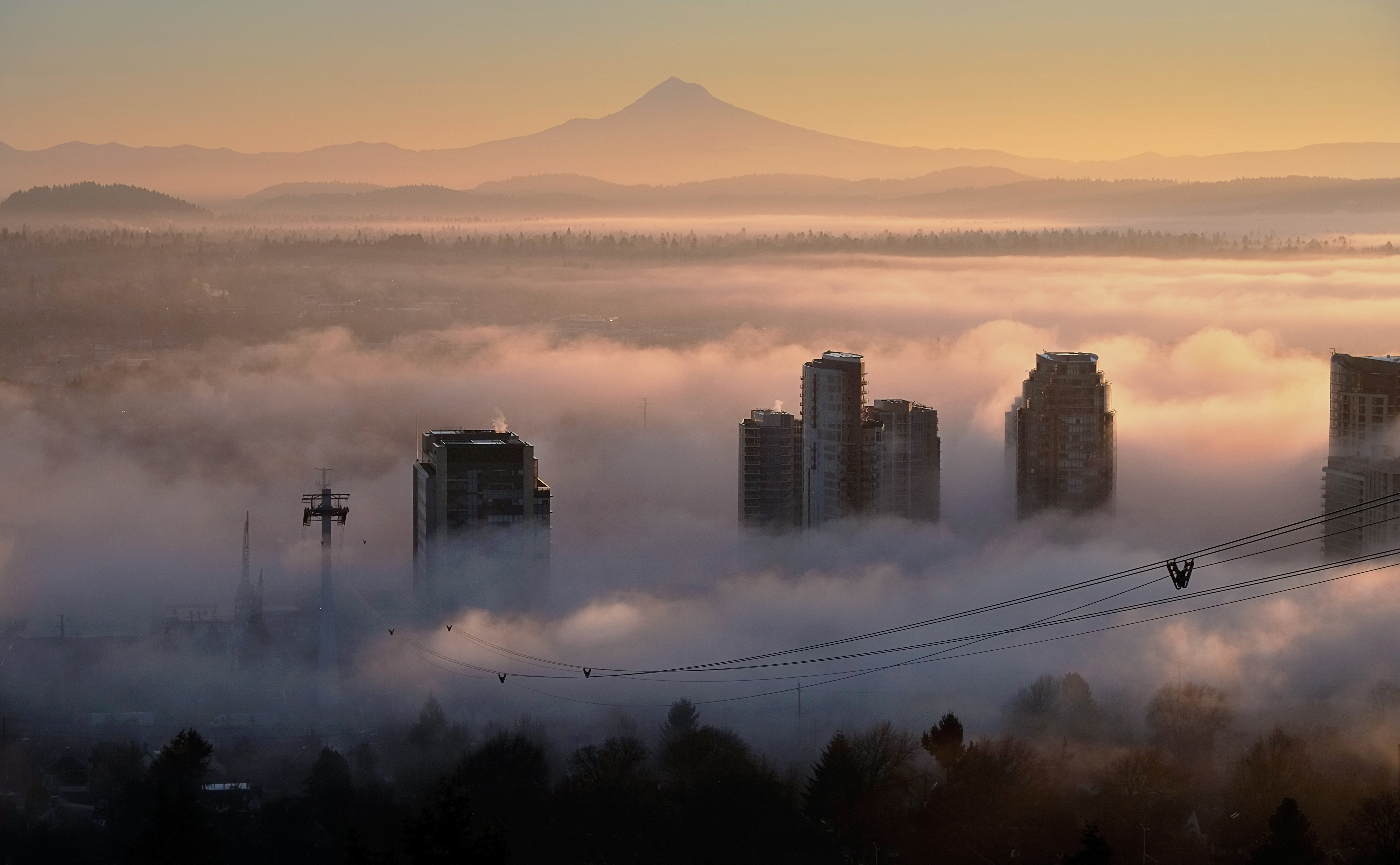 View of Mt Hood in the distance with fog over the South Waterfront