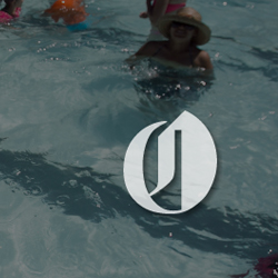 An image of a summer pool scene, with the Oregonian logo transposed on top.
