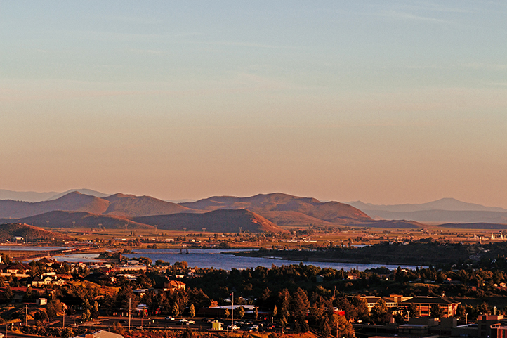 Aerial view of Klamath Falls at sunrise in Southern Oregon with foothills in the background