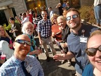Faculty, staff, and residents enjoying the eclipse