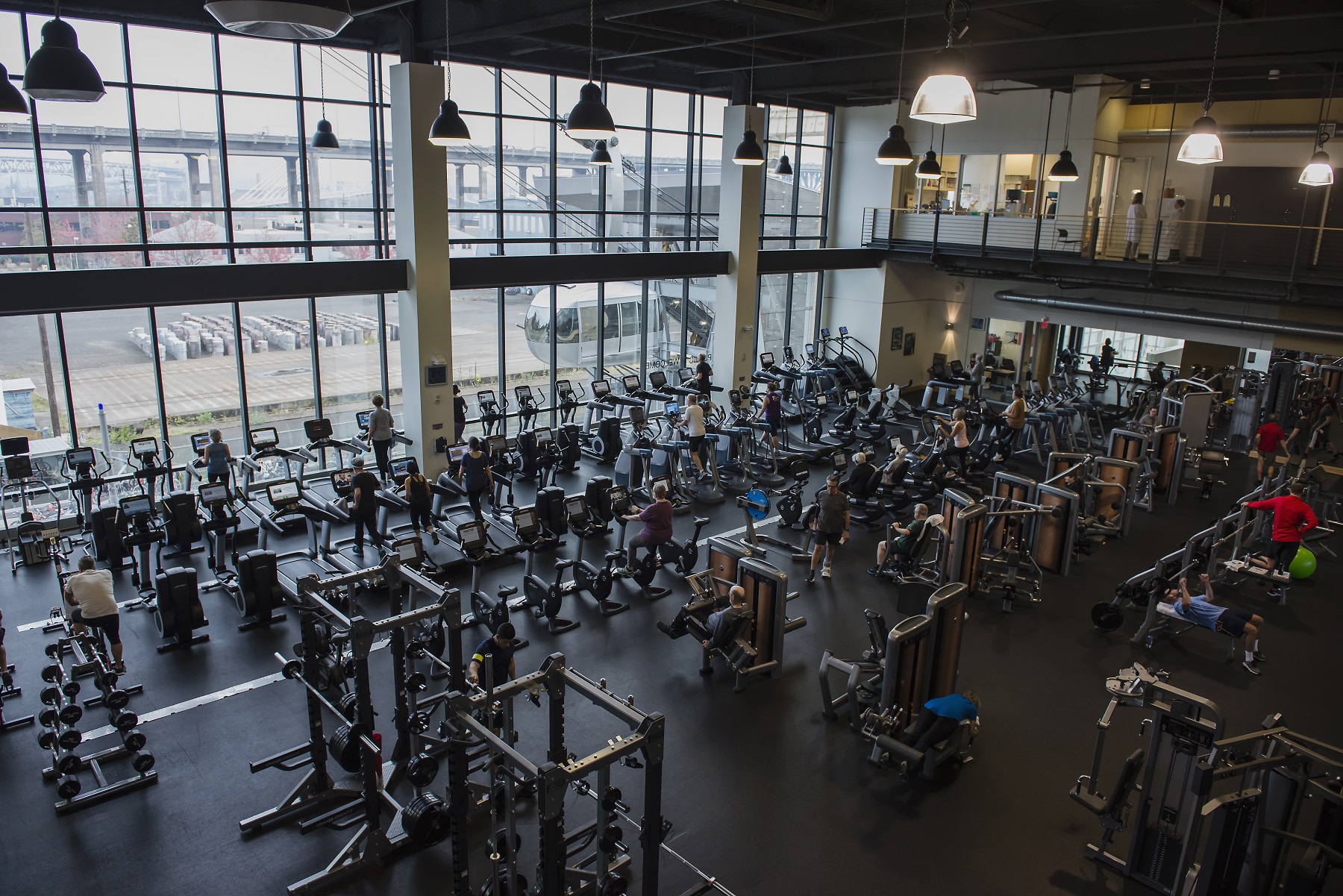 Wide view of fitness floor showing cardiovascular and strength equipment.