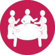 Icon of people talking around a table
