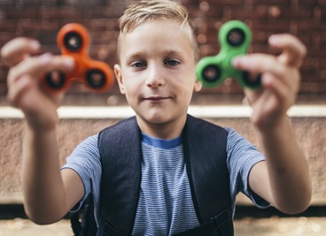 Child with 2 Fidget Spinners