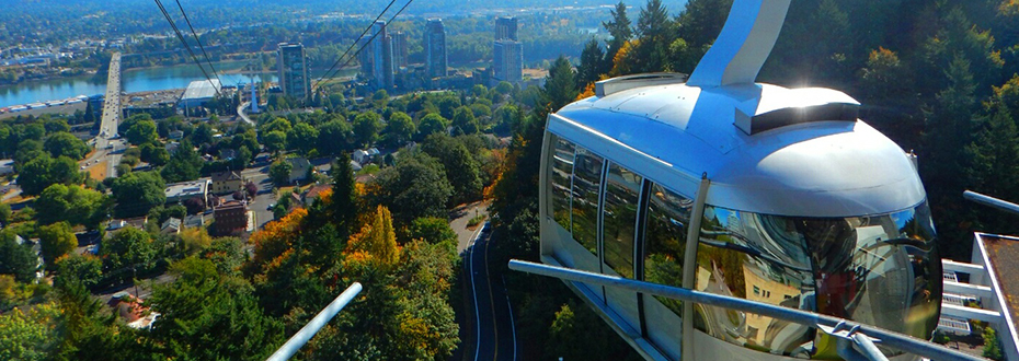 The Portland Aerial Tram arriving at OHSU's Marquam Hill on a sunny morning in summer.