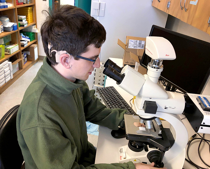 Brendan Cramer interned at OHSU to help scientists learn more about stem cells as a possible treatment for Usher Syndrome, which Creemer has. 