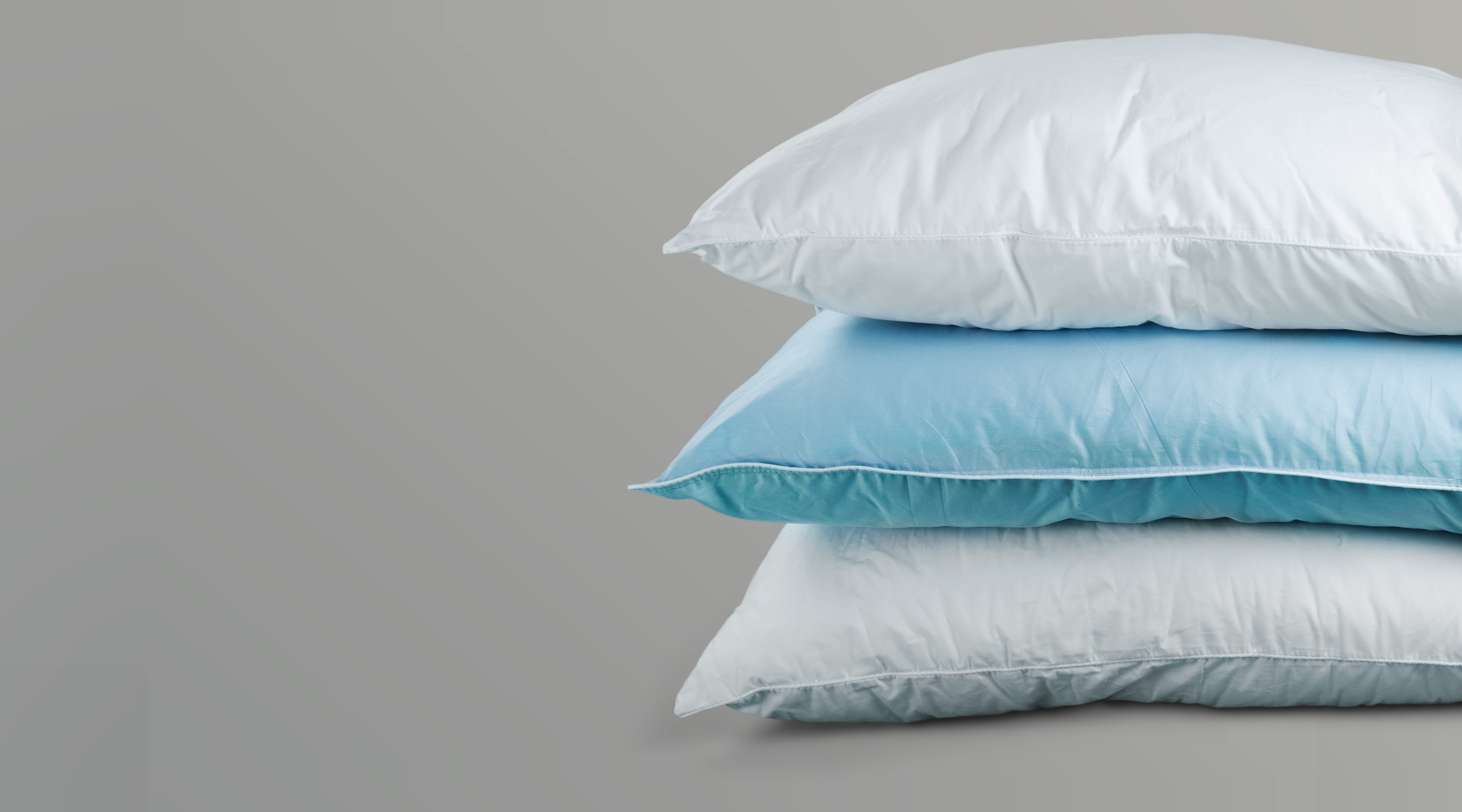 Stack of blue and white pillows