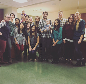 A group of OHSU Pediatric Residents posing after a friends Thanksgiving dinner.