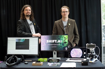 Geoff and Erik with their Shift.AI prototype booth