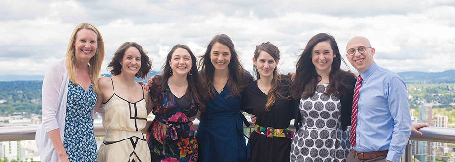A group photo of the 2021 class of OHSU OB/GYN Residents standing on a balcony.