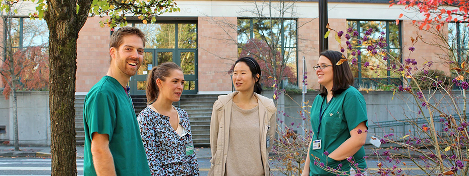 Four nursing students chat on the Portland campus. 