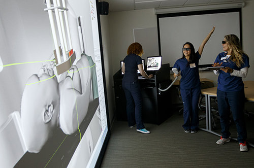 Radiation Therapy students using simulation interactive program.