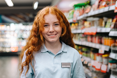 Young worker in a grocery store.