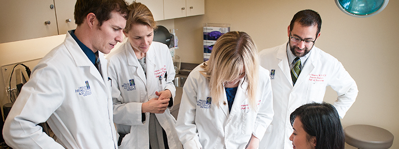 A team of OHSU doctors seeing a patient.