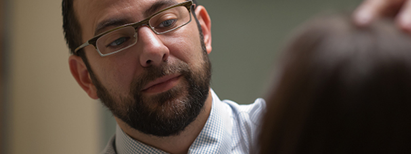 Dr. Eric Simpson examines a patient.