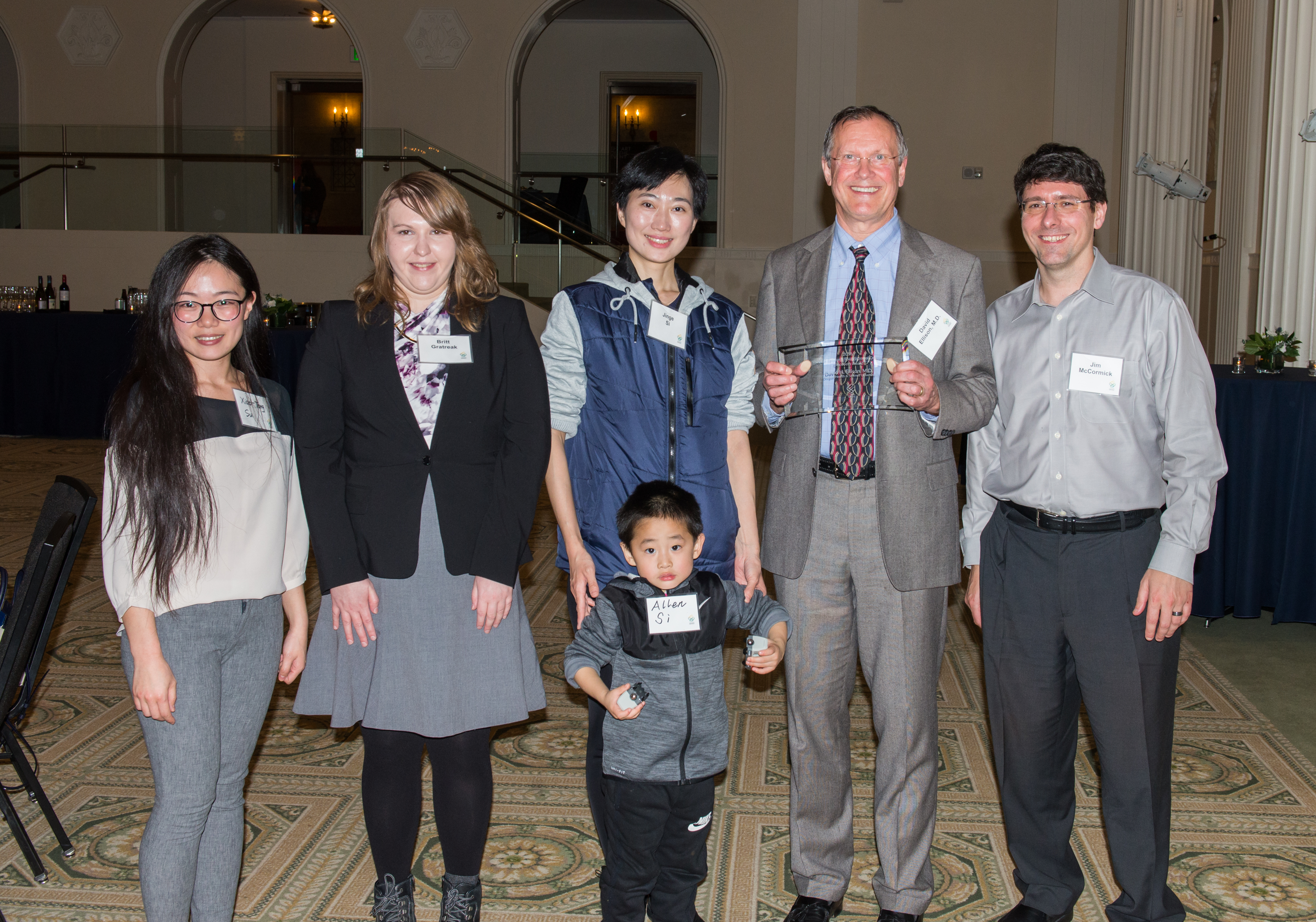 Left to right: Xiao-Tong Su, PhD, Britt Gratreak, Jinge Si, MD, PhD, David Ellison, MD, and Jim McCormick, PhD. Front: Little Allen Si. Medical Research Foundation Awards Dinner. November 2018