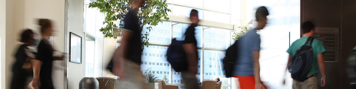 students walking in a hall blurred motion