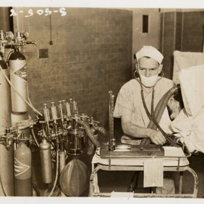 John W. Hutton, M.D., anesthesiologist, in an operating room, 1939