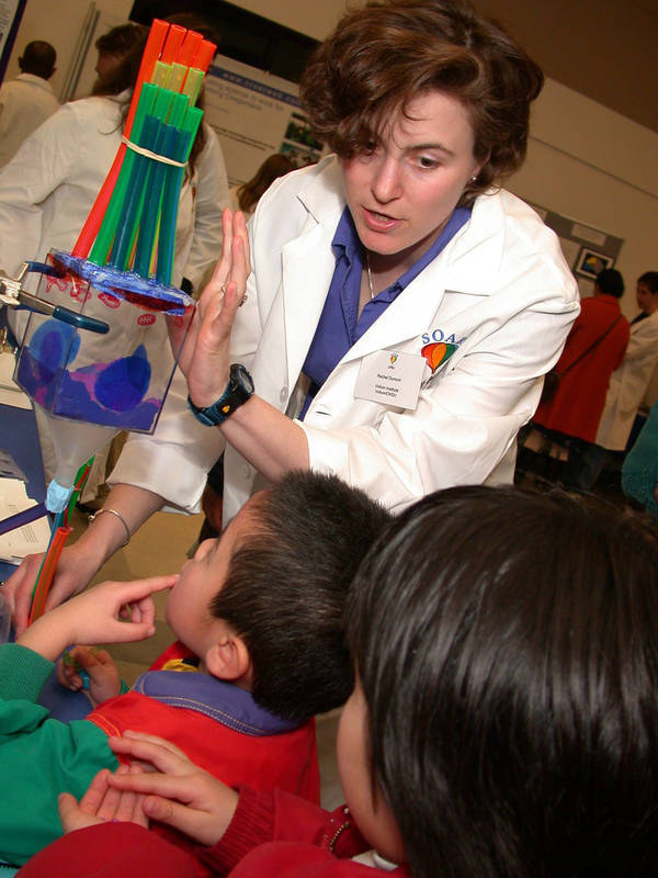 Postdoctoral fellow, Rachel Dumont, demonstrates the structure of the inner ear to attendees of the OHSU Brain Fair, 2002
