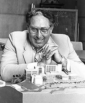 Ed Herbert with an architect's model of the Vollum Institute