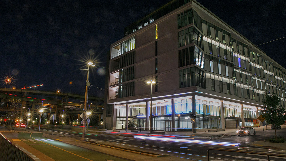 The OHSU Knight Research Building at night.
