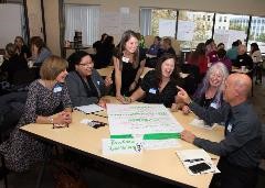 People around a table collaborating