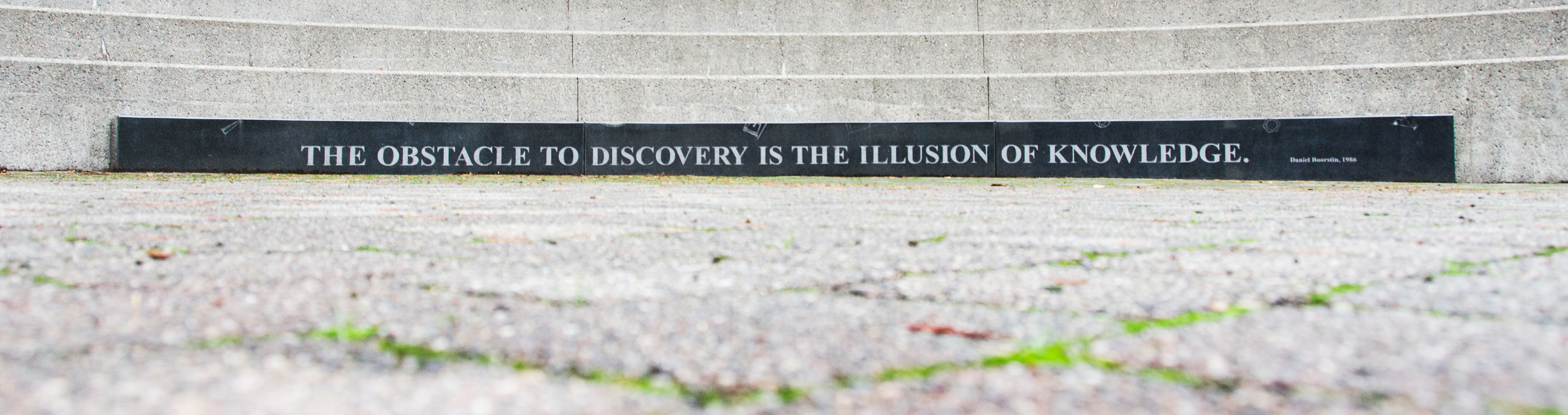 Sculpture with Daniel McClintik quote, "The obstacle to discovery is the illusion of knowledge".