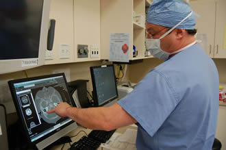 Surgeon viewing a screen