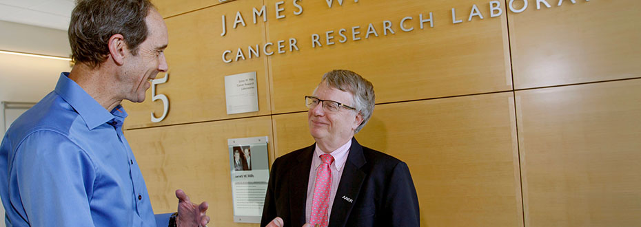 Dr. Brian Druker (left) and Dr. Gordon Mills talking at the OHSU Knight Cancer Research building.