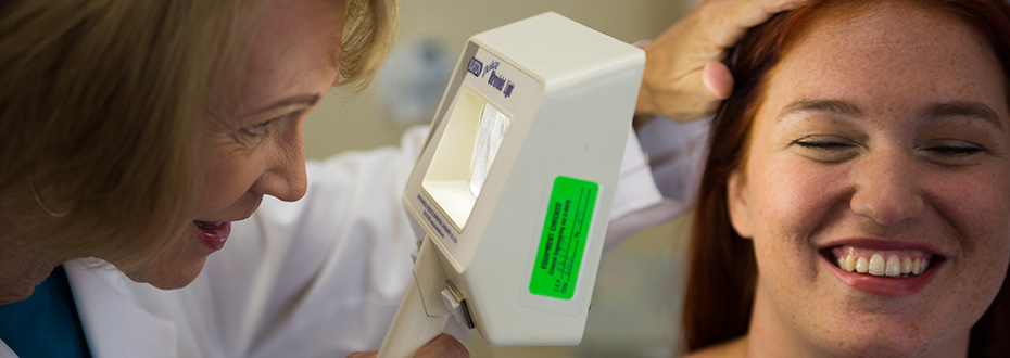 Dr. Susan Tofte, melanoma and skin cancer expert, examines a patient.