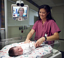 Physician on screen with Neonatal hospital unit