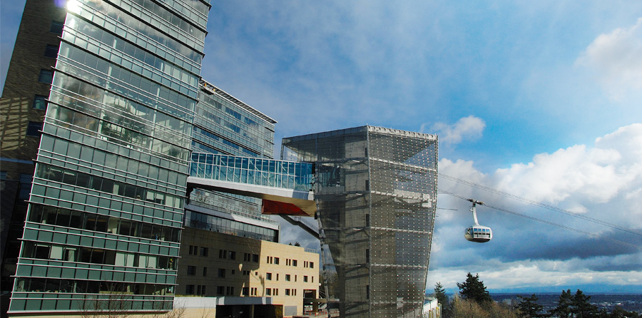 A sunny day view of the Portland Aerial Tram as it arrives at OHSU's Kohler Pavilion