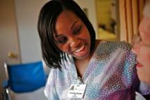 Smiling nurse with a patient