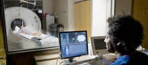 MRI Tech scanning patient for radiology