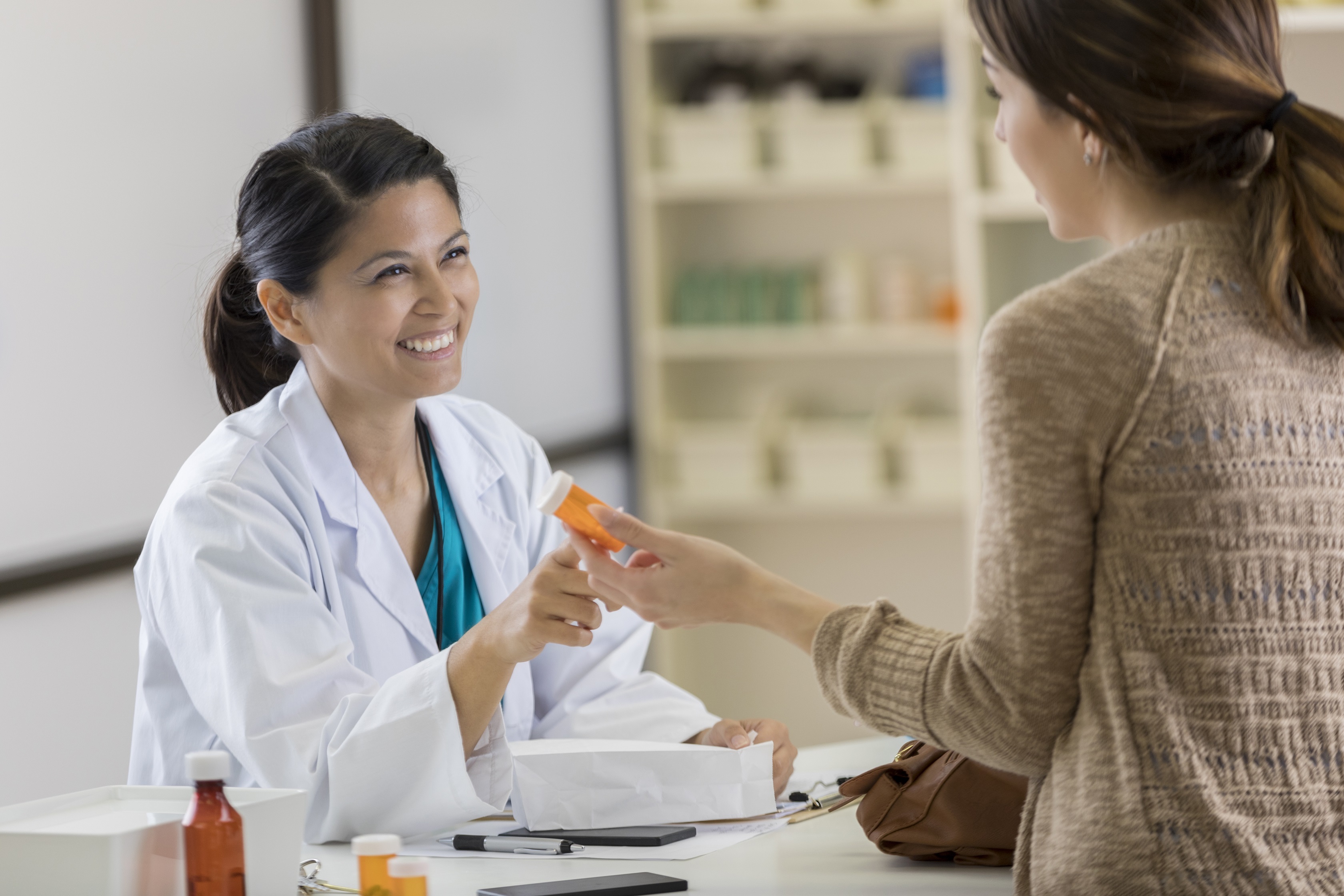Pharmacist Consulting a Patient