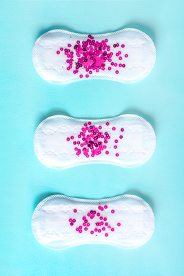 Menstrual pads with pink glitter
