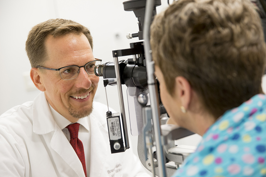 Dr. Lujan doing an eye exam on a patient