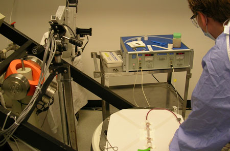 Cardiovascular devices research: Photo shows clinician using equipment.