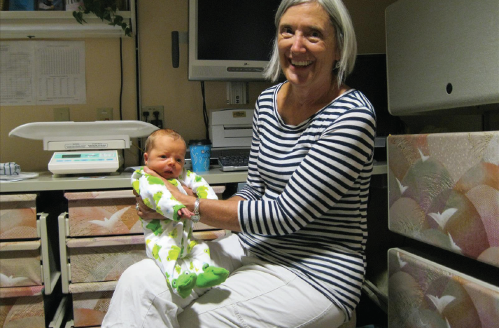 Barb Neff holding an infant