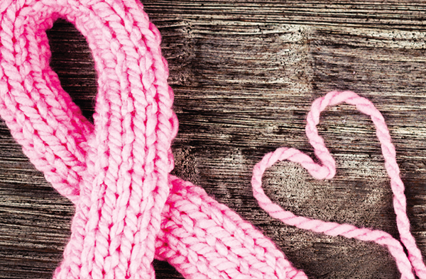 breast cancer awareness ribbon and heart shape made with pink yarn