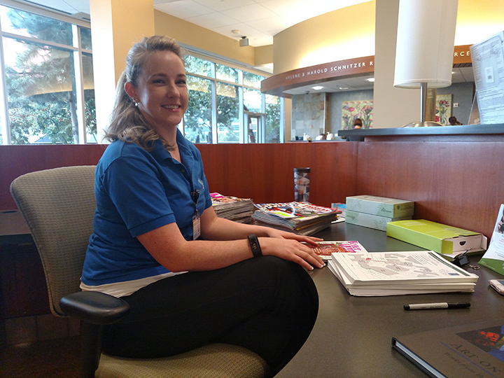 Volunteer Jessica Kelley at a desk in the clinic