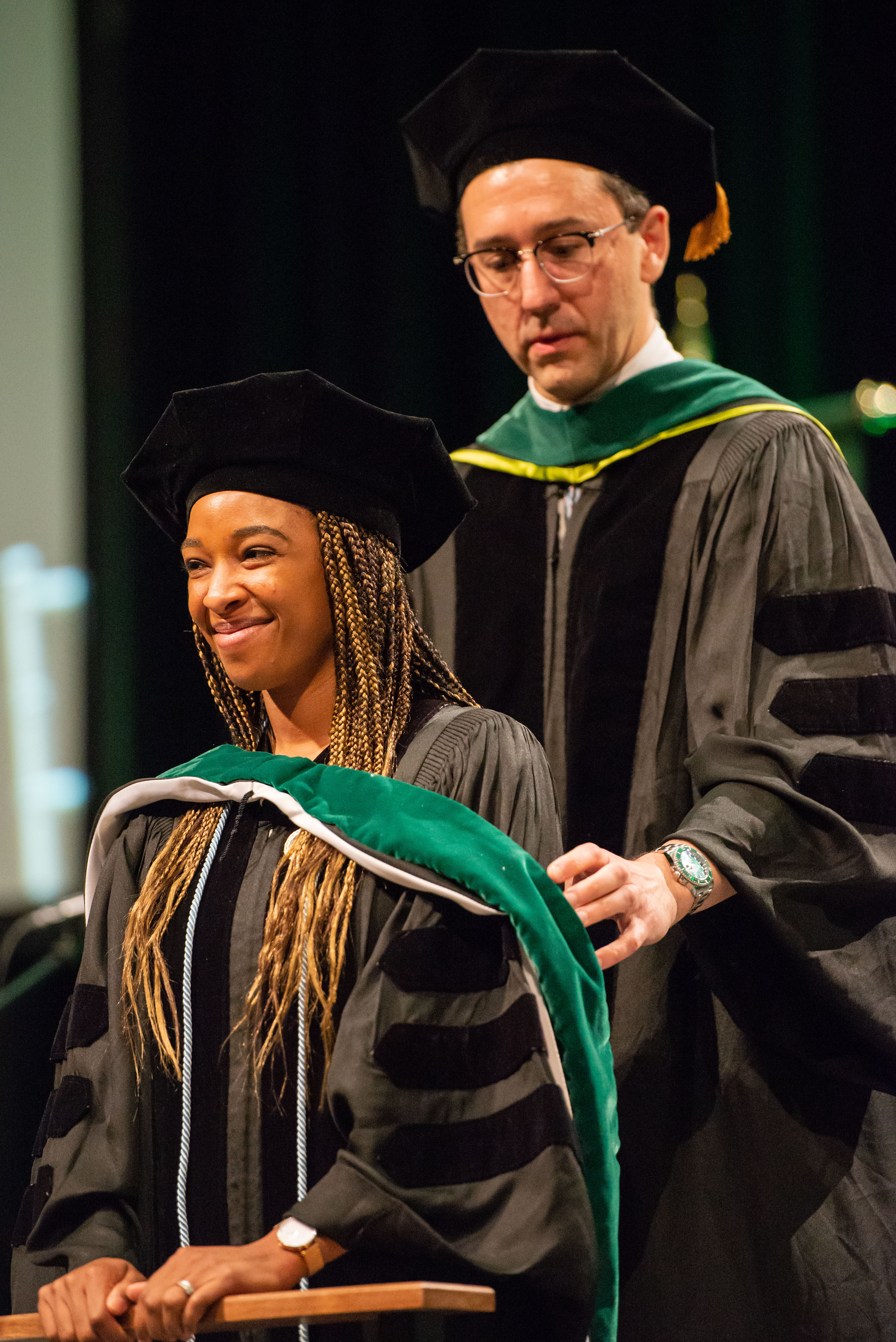 Convocation 2019 - SOM M.D. hooding, Brianna Ennis receives her hood from Dr. David Mansoor