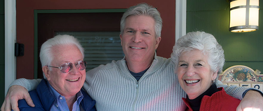 Parkinson's patient Colin Halstead enjoys life after DBS with his parents, Jim and Suzy.